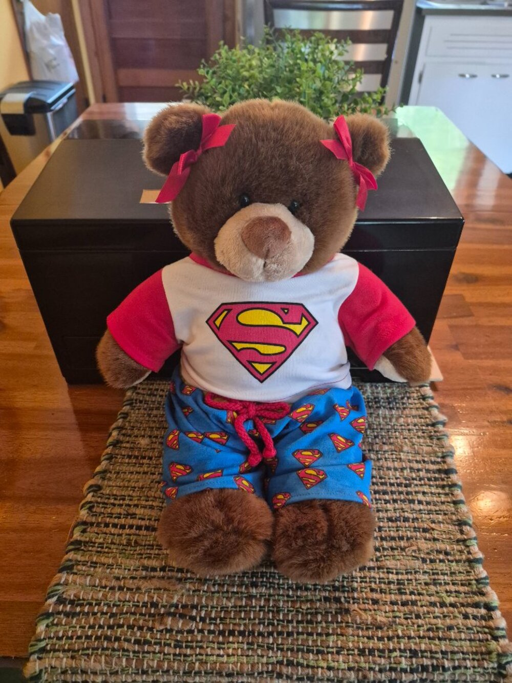 Build-A-Bear Workshop teddy bear wears a casual Superman-themed outfit with bows